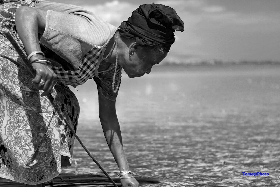 woman collecting shellfish