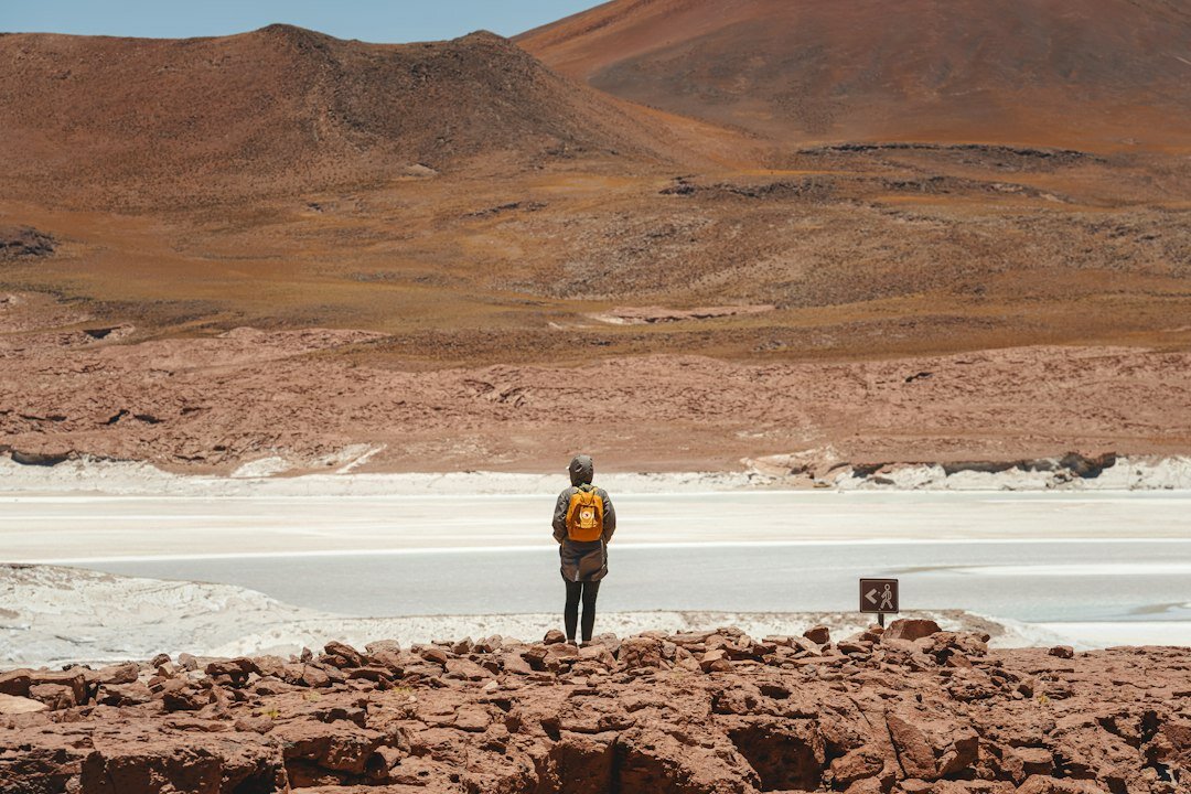miner with telescope in atacama desert