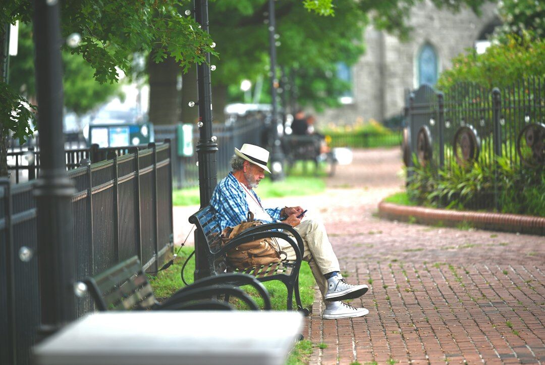 elderly person sitting park
